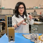 Ali Guarneros Luna holding CubeSats