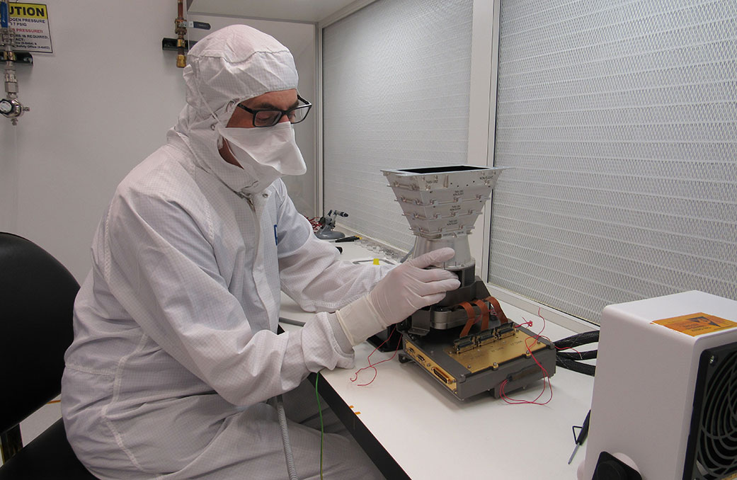 An engineer at the Johns Hopkins Applied Physics Laboratory (APL) works with an engineering model 