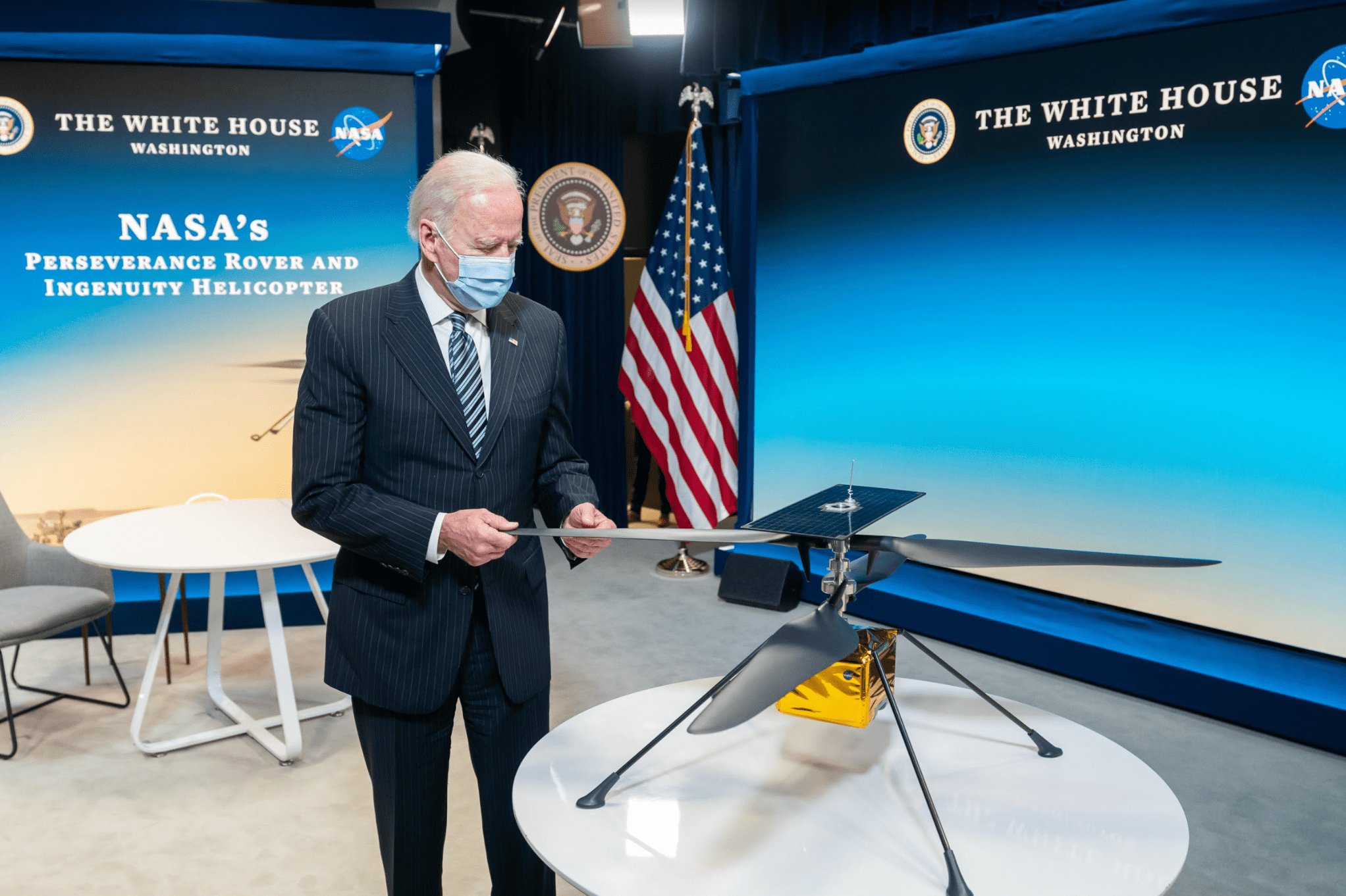 President Joe Biden stands with a model of the Ingenuity Mars Helicopter, which achieved its first flight on the Red Planet April 19.