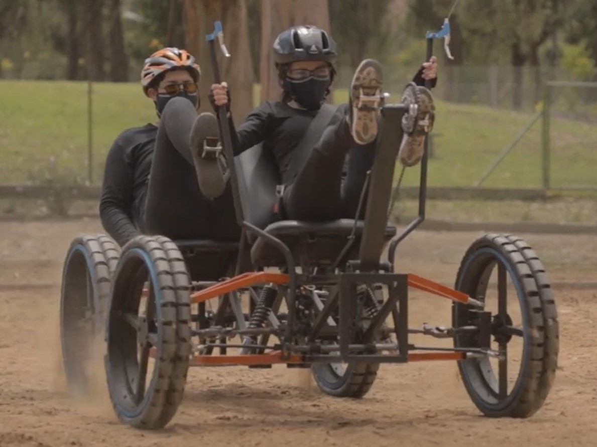 Two students driving a human powered rover