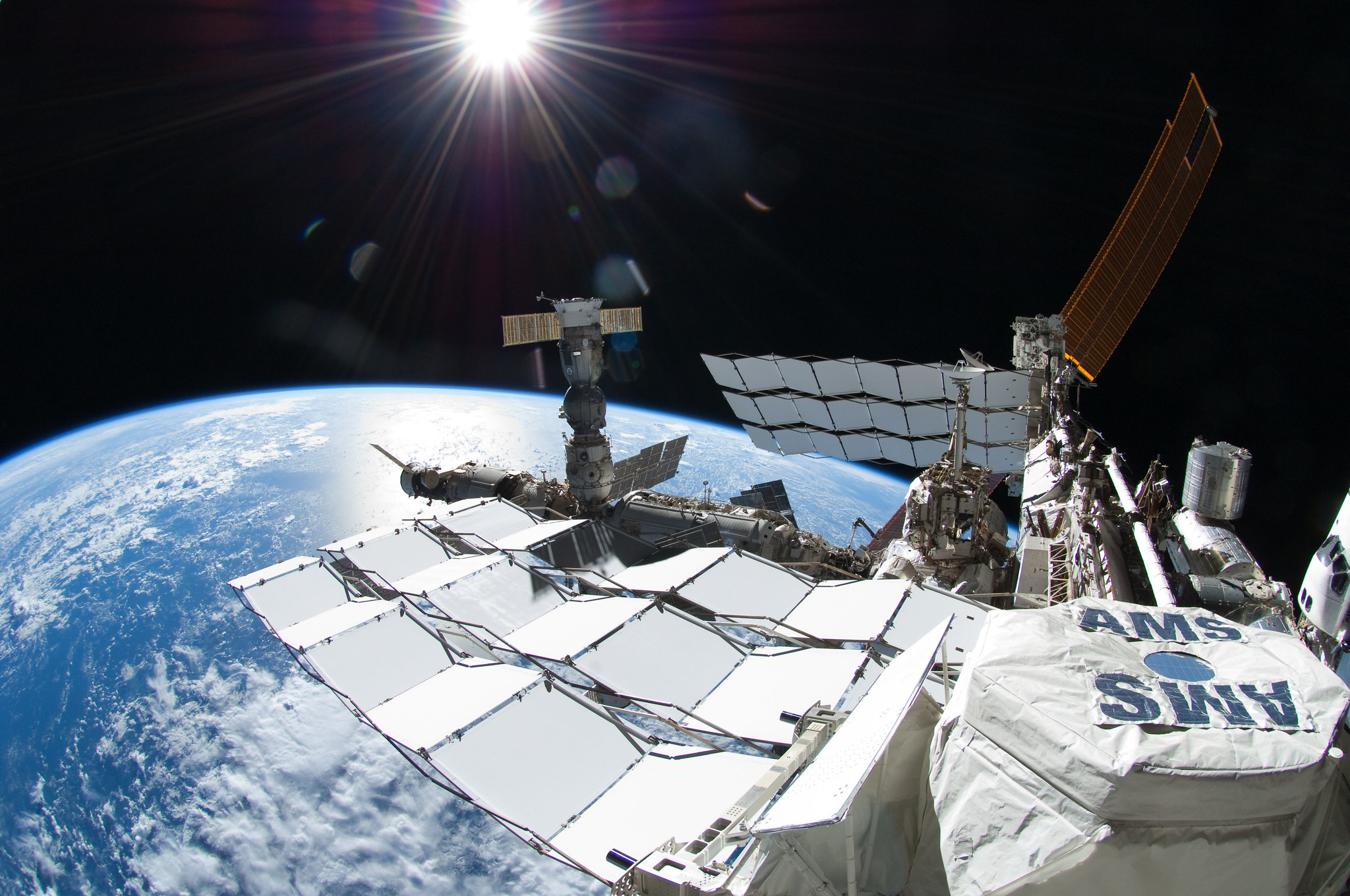 image of instrument, space station exterior and Earth