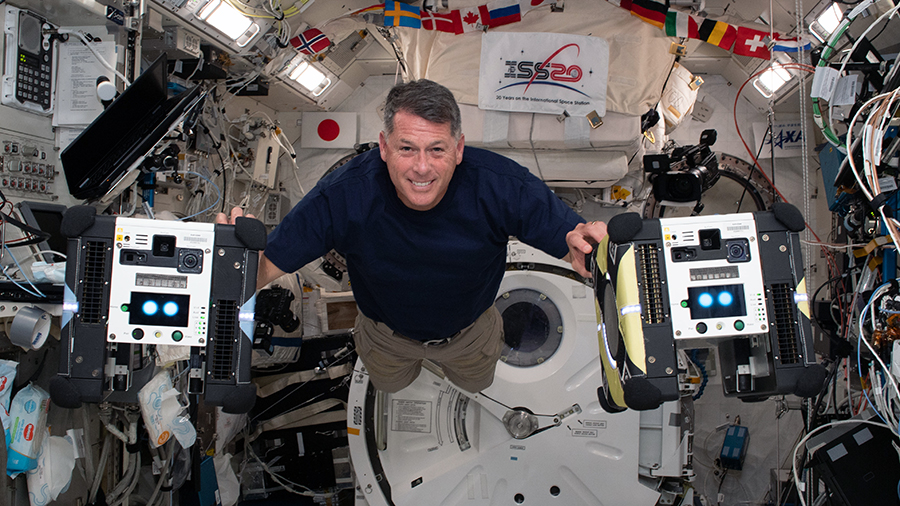 NASA astronaut Shane Kimbrough is pictured inside the Kibo laboratory module with the Astrobee free-flying robotic assistants. Credits: NASA