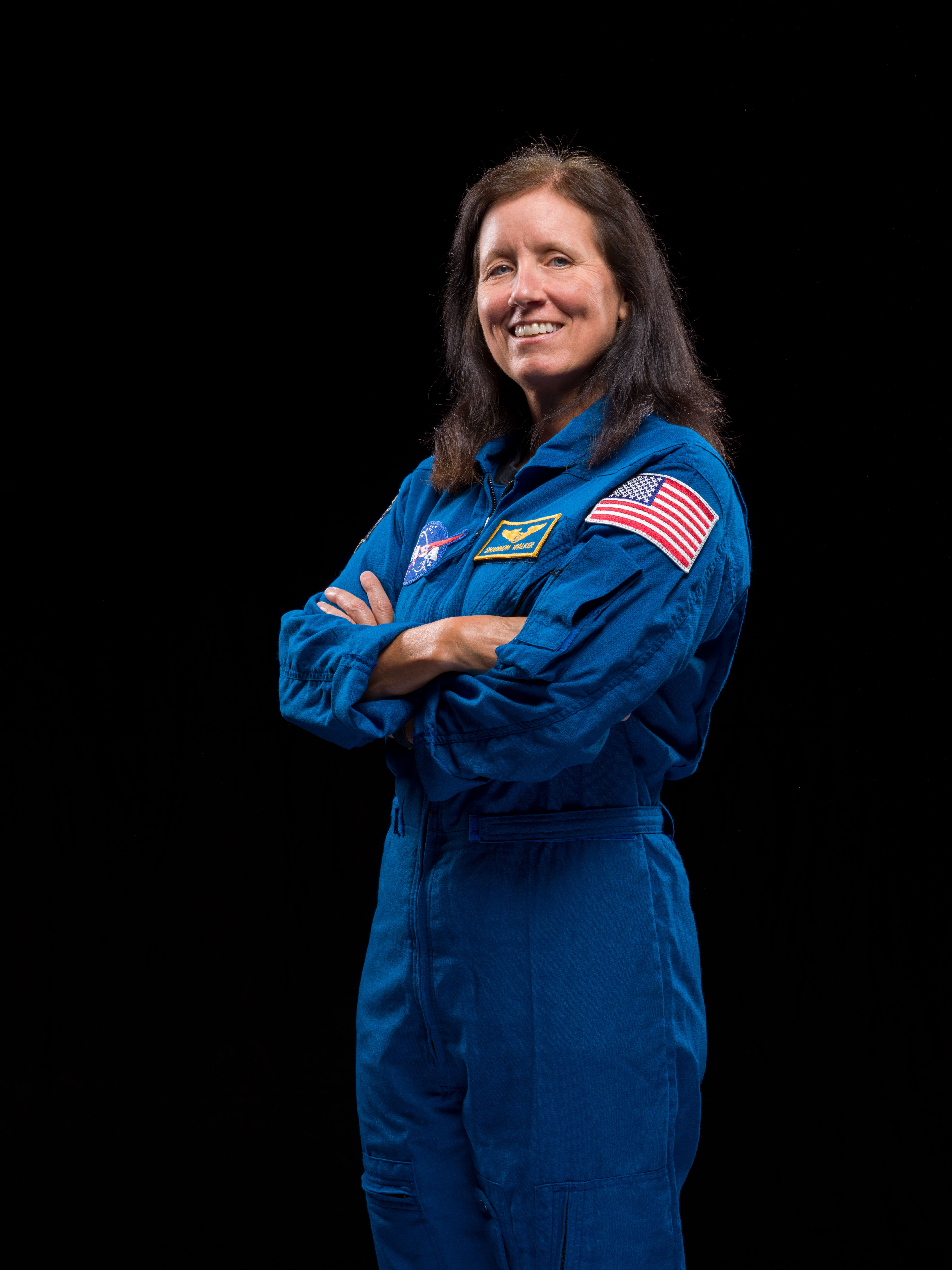 NASA's SpaceX Crew-1 Mission Specialist Shannon Walker is photographed in her blue NASA flight suit.