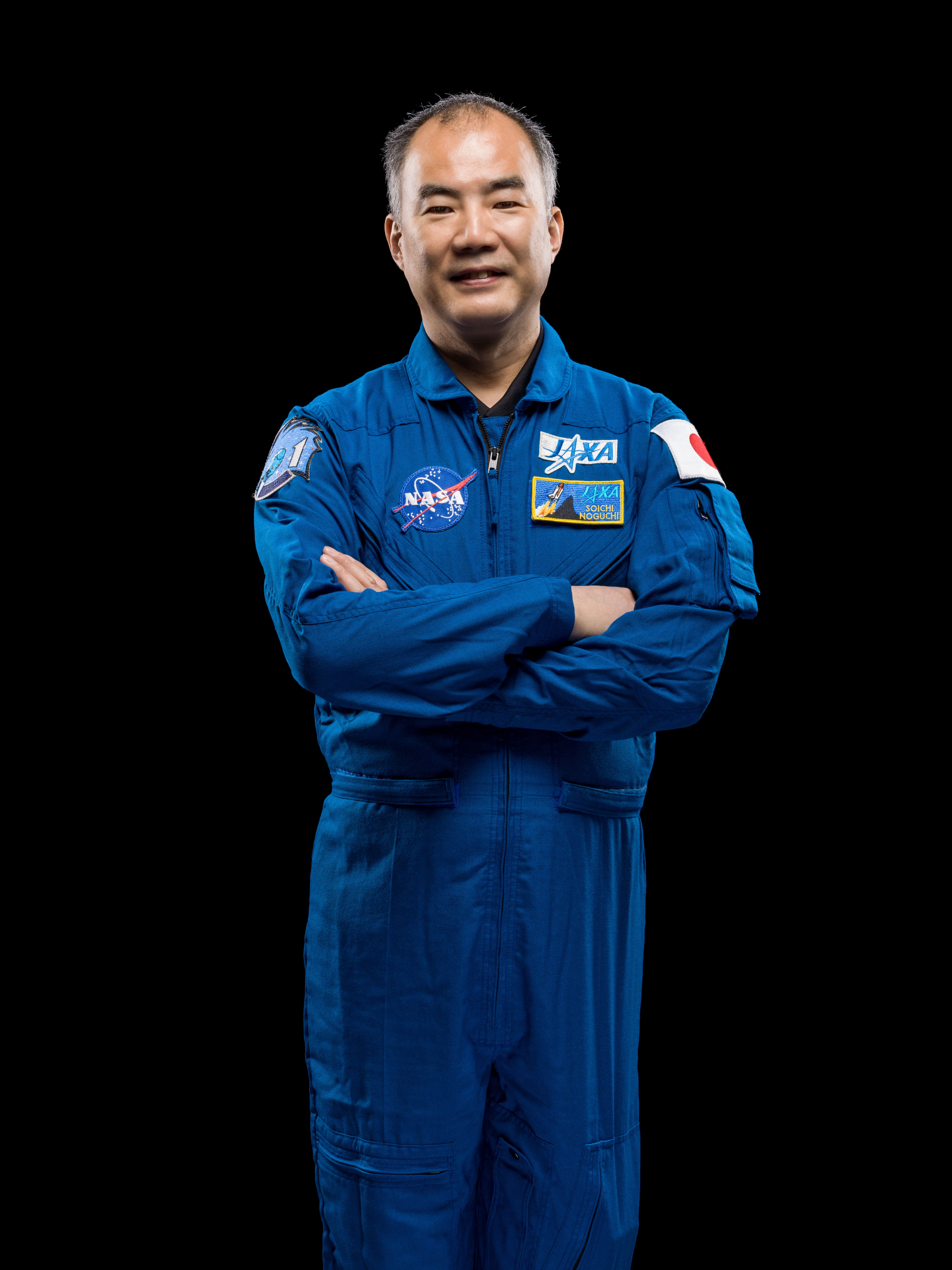 NASA's SpaceX Crew-1 Mission Specialist Soichi Noguchi is photographed in his blue Japan Aerospace Exploration Agency (JAXA) flight suit.