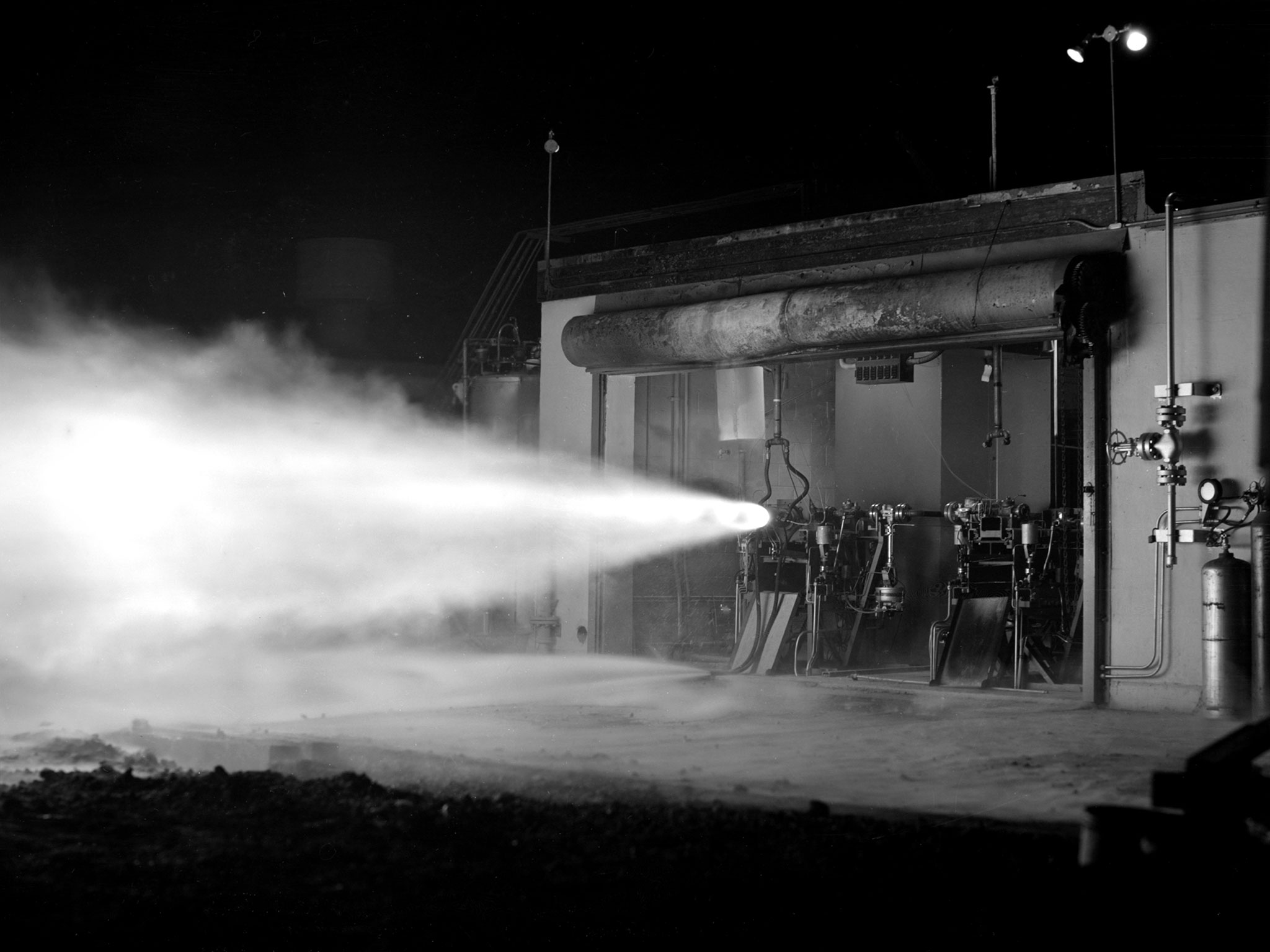 Nighttime firing of an engine out of a test cell.