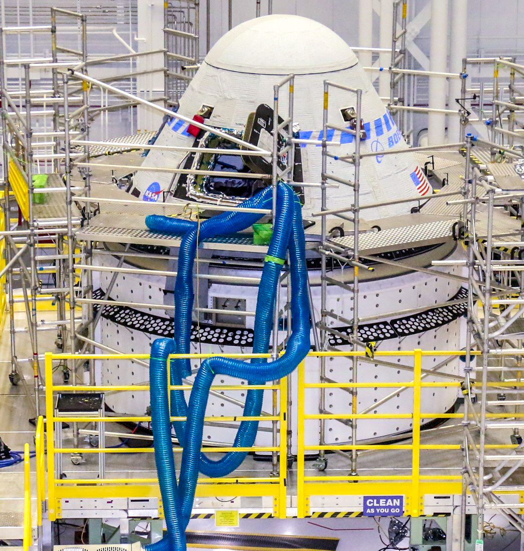 Boeing’s CST-100 Starliner spacecraft undergoes preparations for the company’s Orbital Flight Test-2 (OFT-2) in the Commercial Crew and Cargo Processing Facility at NASA’s Kennedy Space Center in Florida.