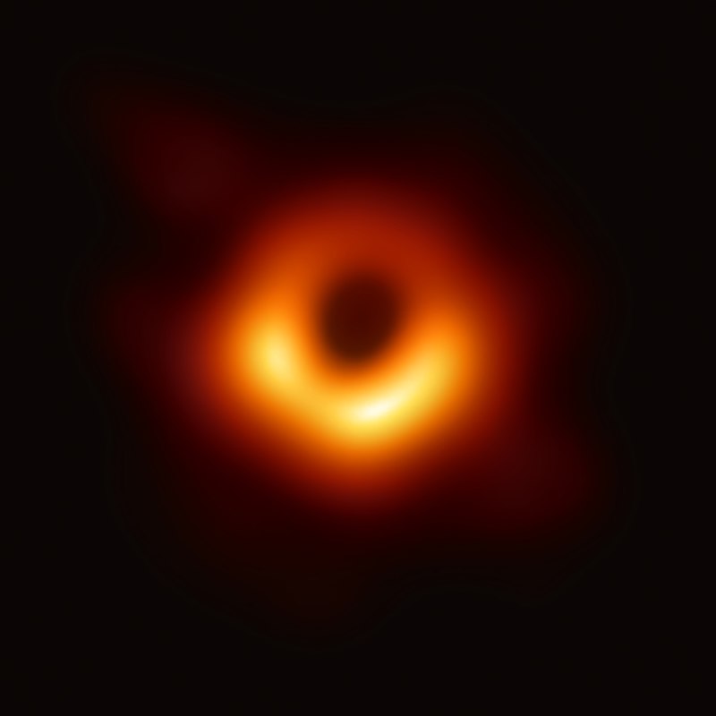 blurry irregular red-orange ring in blackness with a dark center