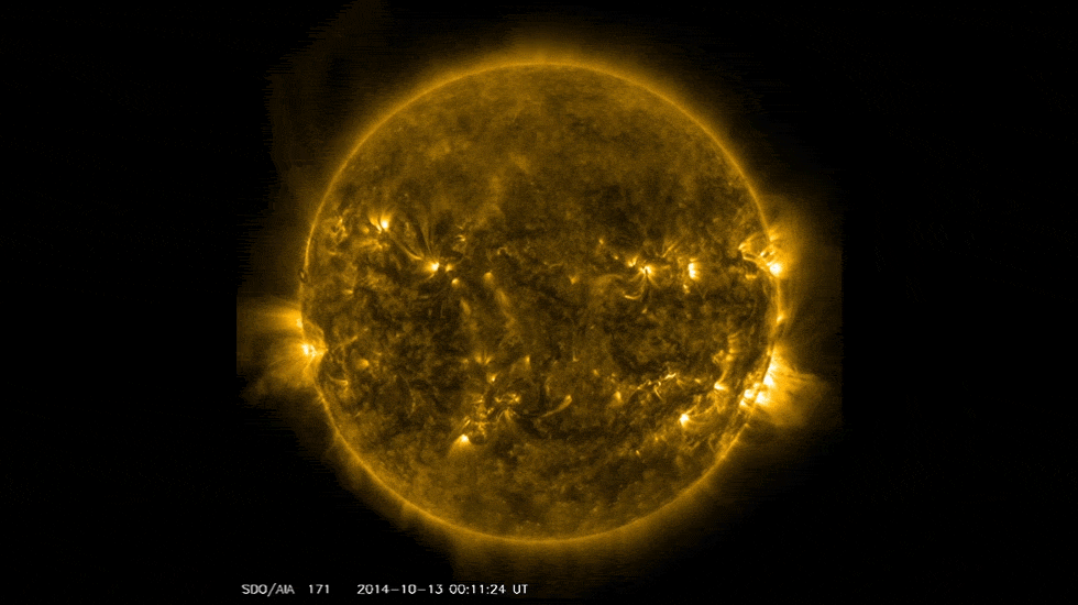 An extreme ultraviolet view shows the Sun dotted with active regions and loops