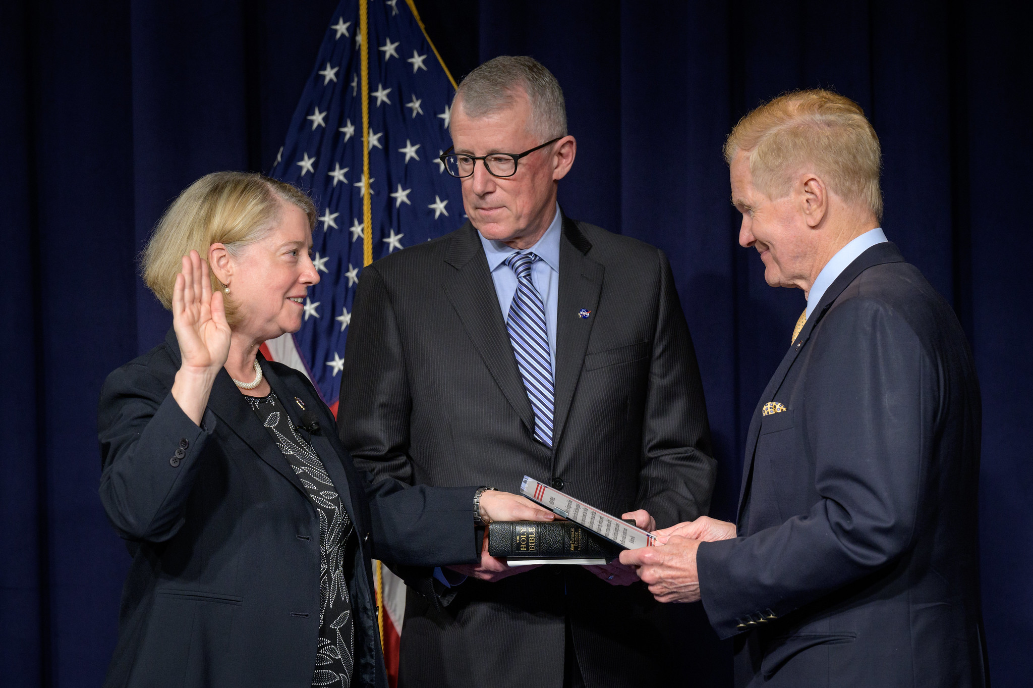 Pam Melroy is ceremonially sworn-in as the 15th NASA Deputy Administrator by NASA Administrator Bill Nelson, as her husband Doug Hollett, holds their family Bible, Monday, June 21, 2021, at the Mary W. Jackson NASA Headquarters building in Washington.