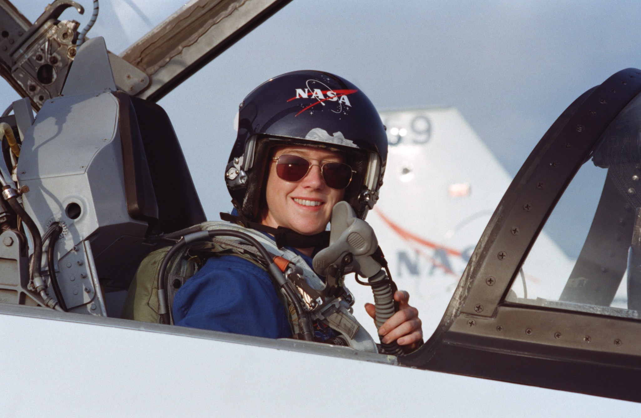 Pam Melroy, seated in forward station of a T-38 jet trainer in 2000 prior to joining other astronauts to train for a mission to the International Space Station.