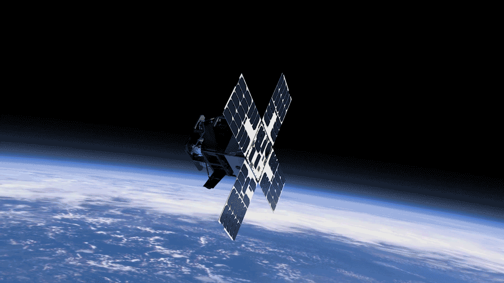 A small spacecraft in Earth orbit deploys solar sail