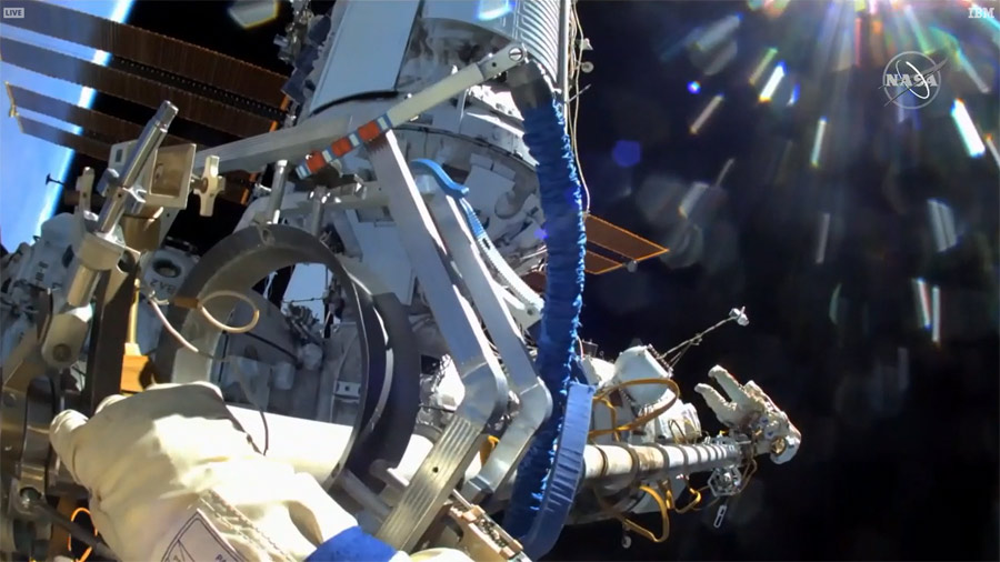 Pyotr Dubrov's helmet camera spots Oleg Novitskiy on the other end of the 46-foot-long (14 meters) Strela boom, a Russian crane, that the spacewalkers detached from the Pirs airlock.