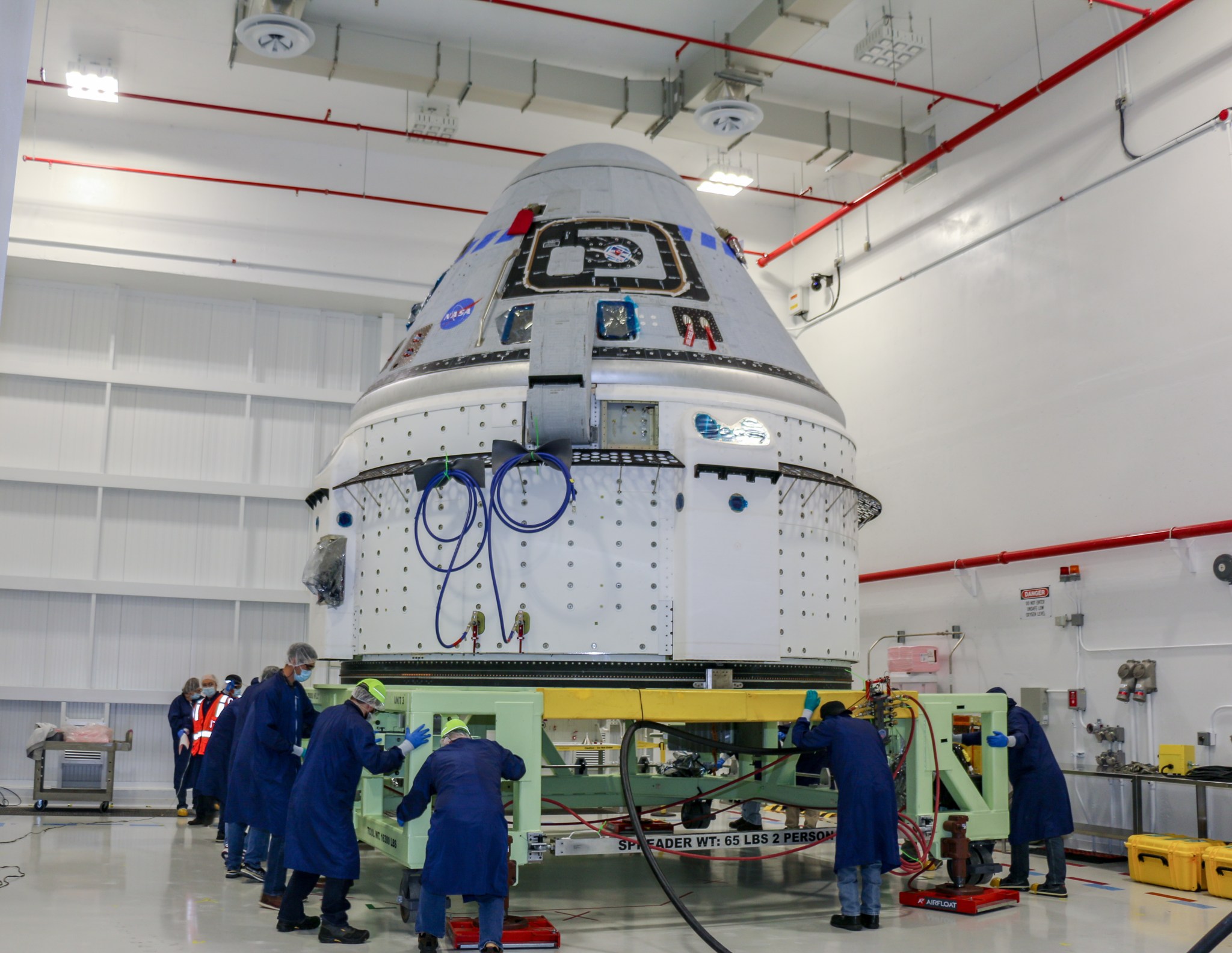 The Boeing CST-100 Starliner spacecraft to be flown on Orbital Flight Test-2 (OFT-2) is seen in the Commercial Crew and Cargo Processing Facility at NASA’s Kennedy Space Center in Florida on June 2, 2021.