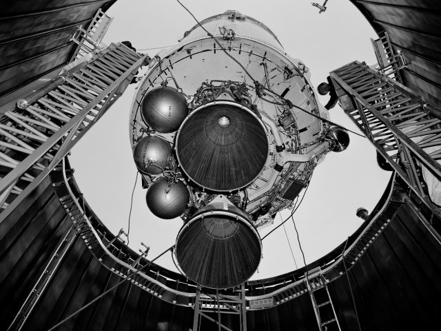 Centaur rocket being lowered into a test chamber.