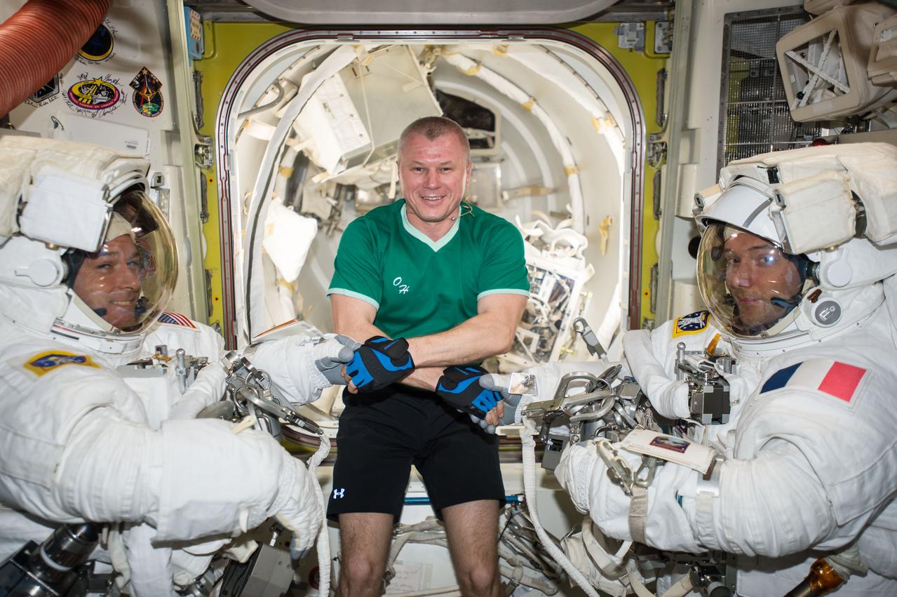 Russian cosmonaut Oleg Novitskiy (middle) poses with Expedition 50 Commander Shane Kimbrough of NASA (left) and Flight Engineer Thomas Pesquet of ESA (European Space Agency) (right) prior to their spacewalk March 24, 2017.
