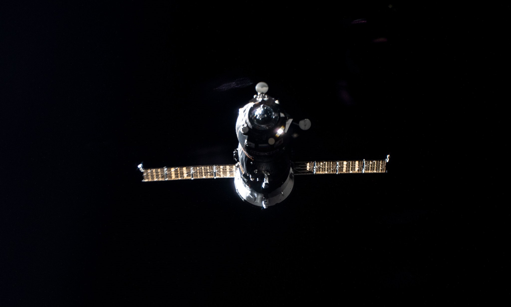 The uncrewed ISS Progress 77 resupply ship pictured approaching the International Space Station