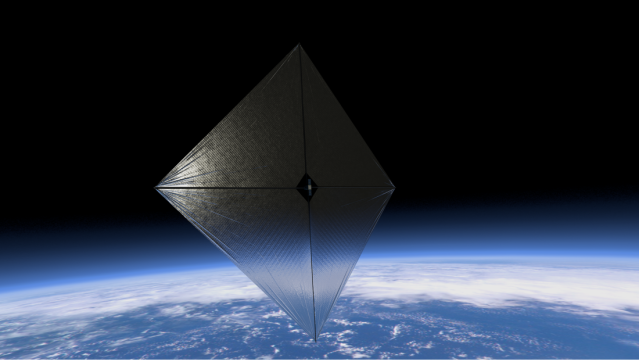 Solar sail in space above the earth.