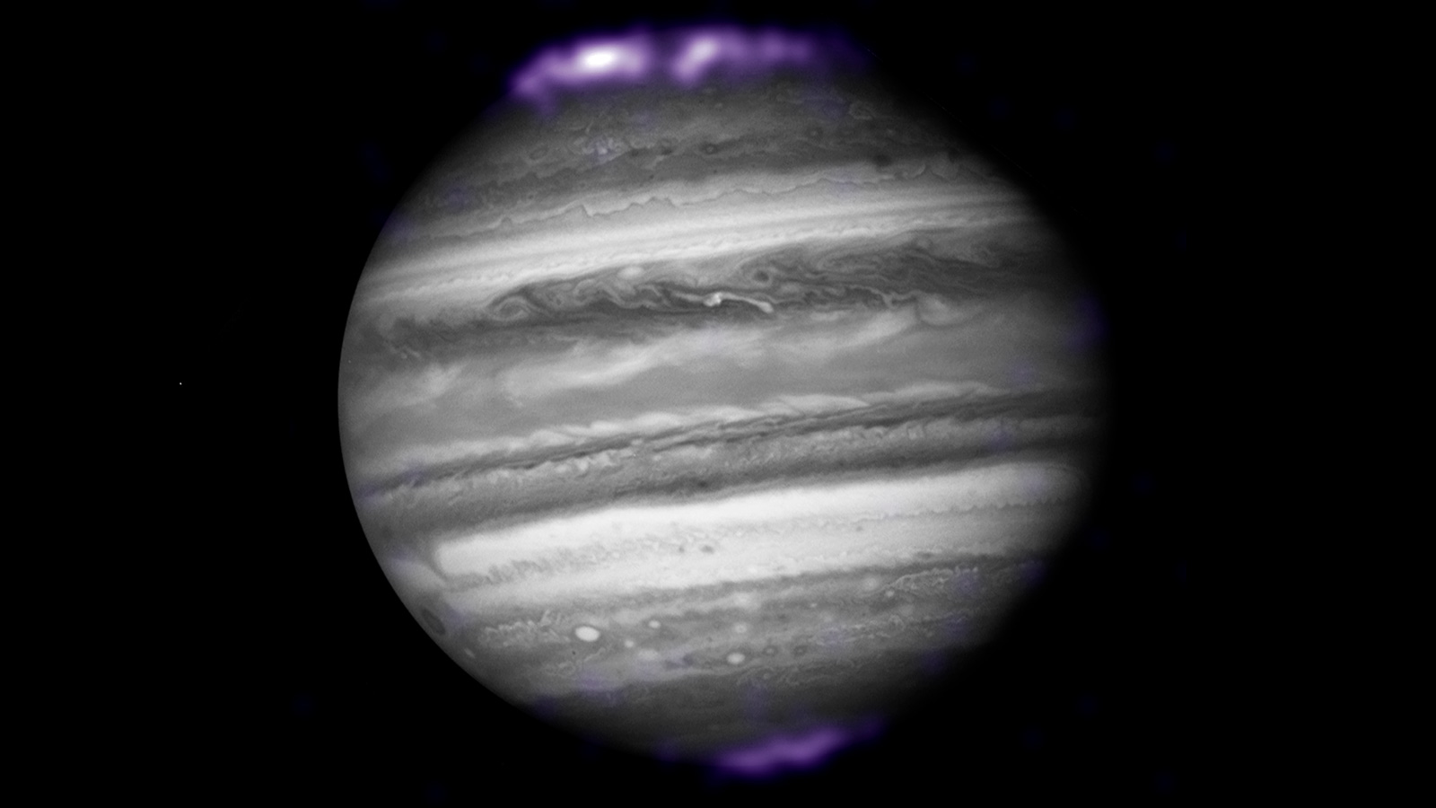 The purple hues in this image show X-ray emissions from Jupiter’s auroras, detected by NASA’s Chandra Space Telescope in 2007