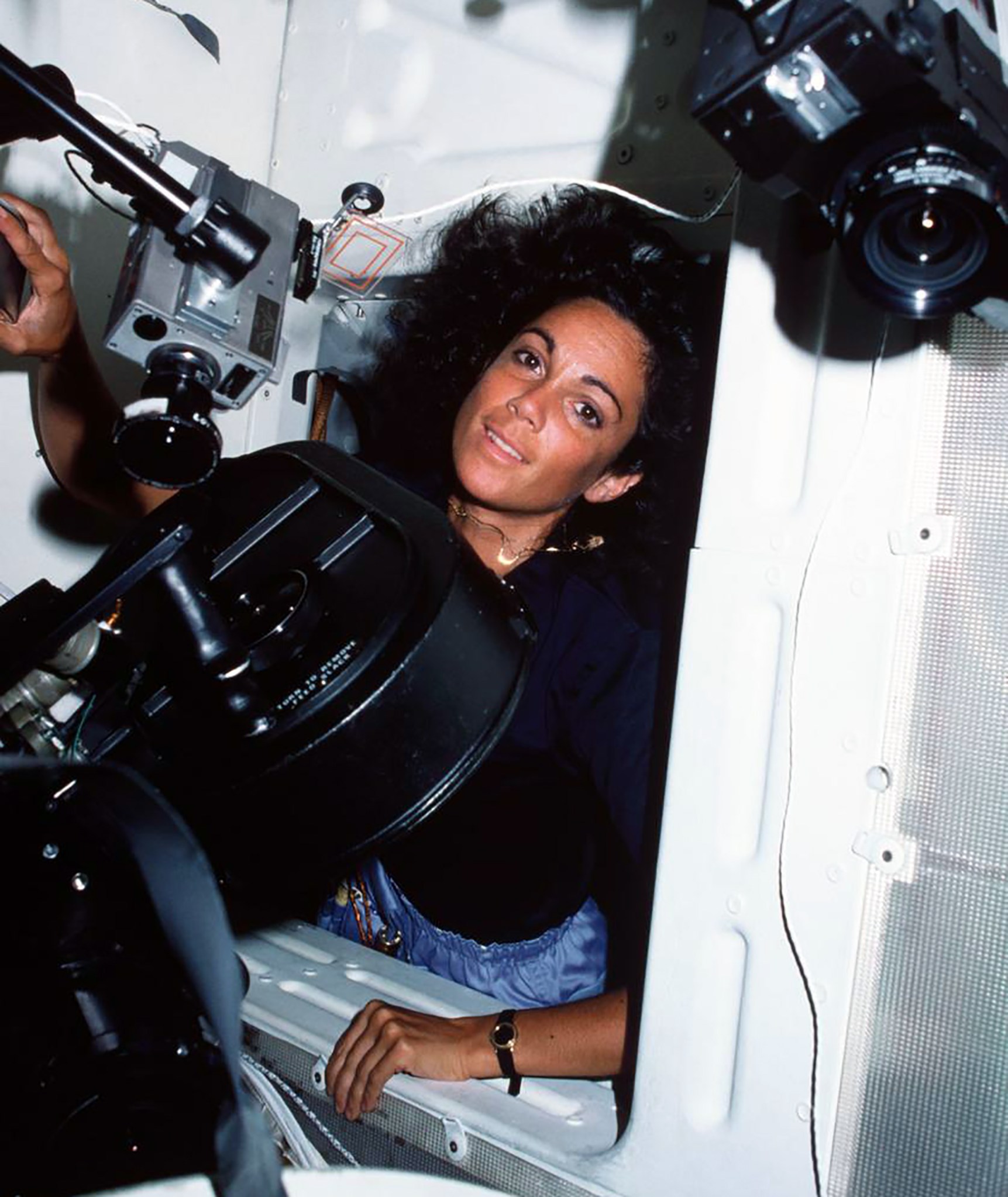 Judy Resnik pictured with imaging equipment aboard the space shuttle.