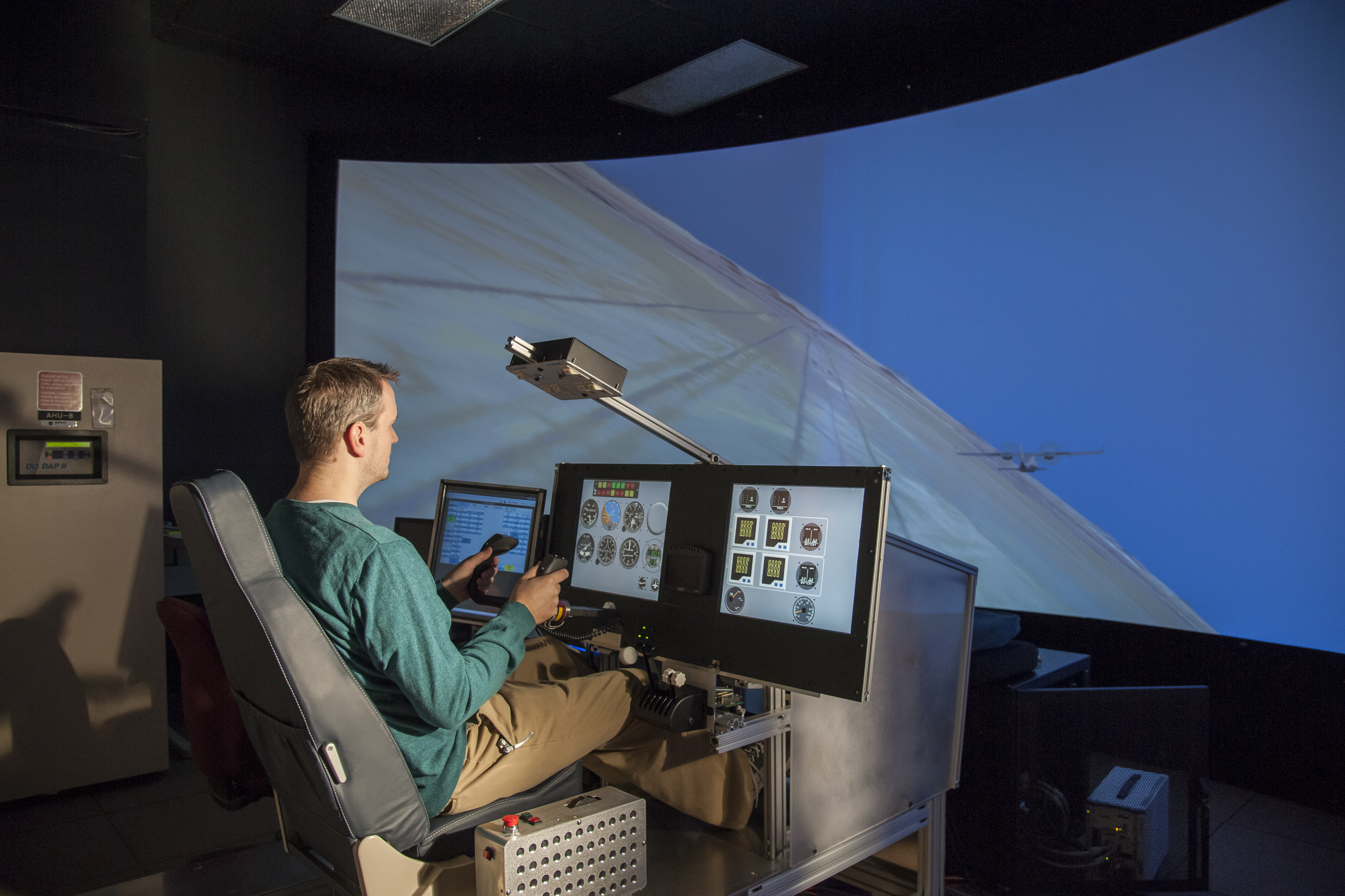 X-57 principal investigator Sean Clarke flies the X-57 simulator.