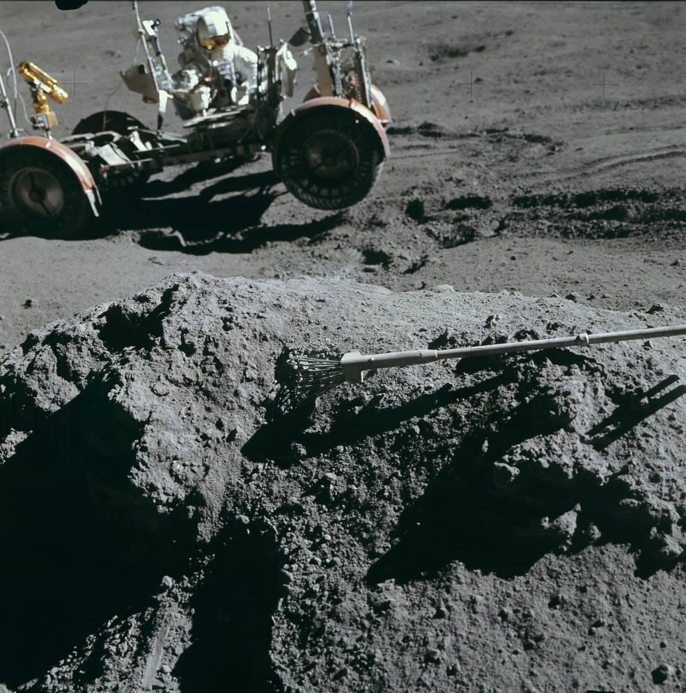 apollo_15_moon_landing_24_eva2_irwin_keeping_rover_from_sliding_down_hill