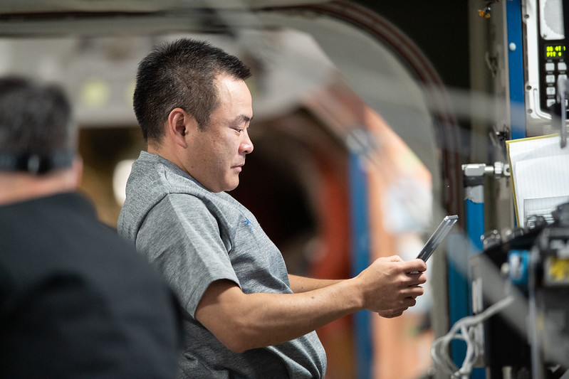 Expedition 65 Commander Akihiko Hoshide of the Japan Aerospace Exploration Agency reviews procedures on a computer tablet for the InSPACE-4 physics study. Credits: NASA