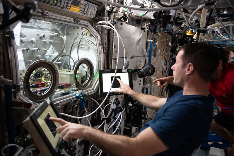 Expedition 65 Flight Engineer Thomas Pesquet of ESA (European Space Agency) works with a science experiment within the Microgravity Science Glovebox. Credits: NASA