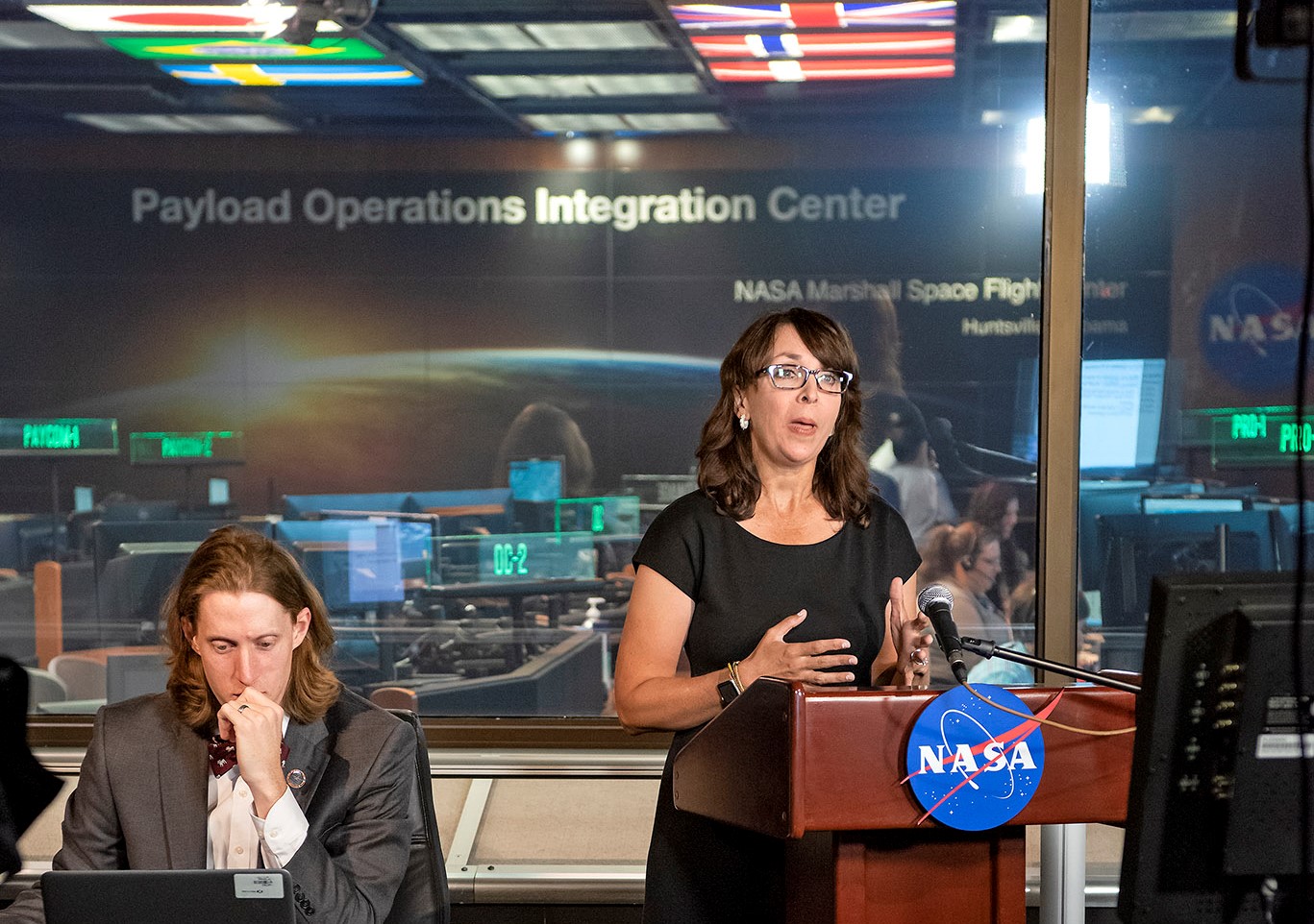 Erek Allen, left, a Payload Operations director, and Gina Wade, a technical trainer in the Payload Operations Integration Center.