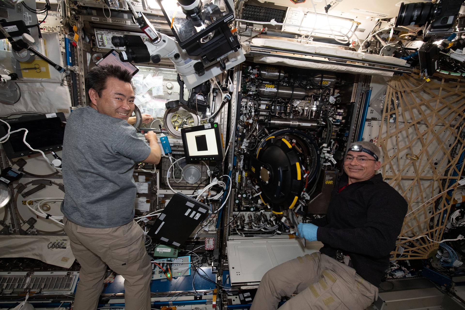 Expedition 65 astronauts Commander Akihiko Hoshide (left) and Flight Engineer Mark Vande Hei