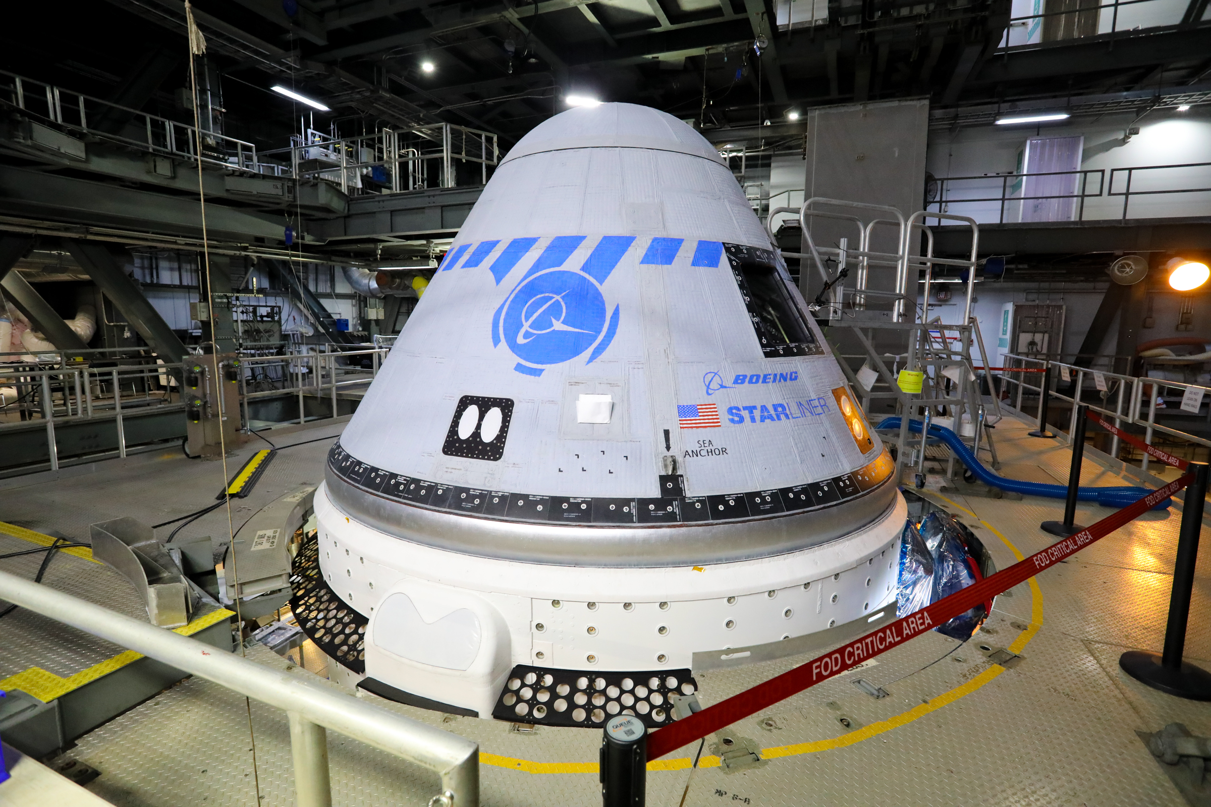 Boeing's CST-100 Starliner spacecraft is in view in the United Launch Alliance Vertical Integration Facility at Space Launch Complex 41 on Aug. 9, 2021.