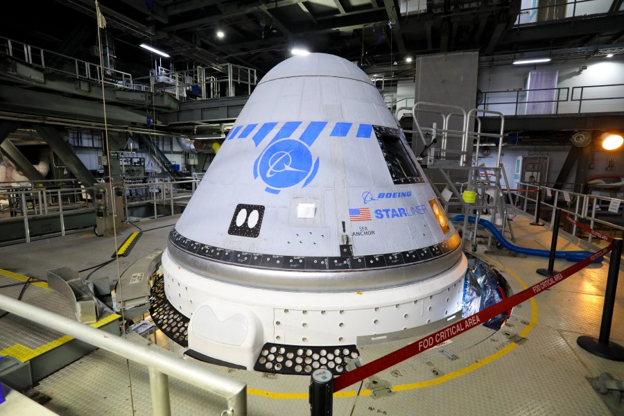 Boeing's CST-100 Starliner spacecraft is in view in the United Launch Alliance Vertical Integration Facility at Space Launch Complex 41 on Aug. 9, 2021.