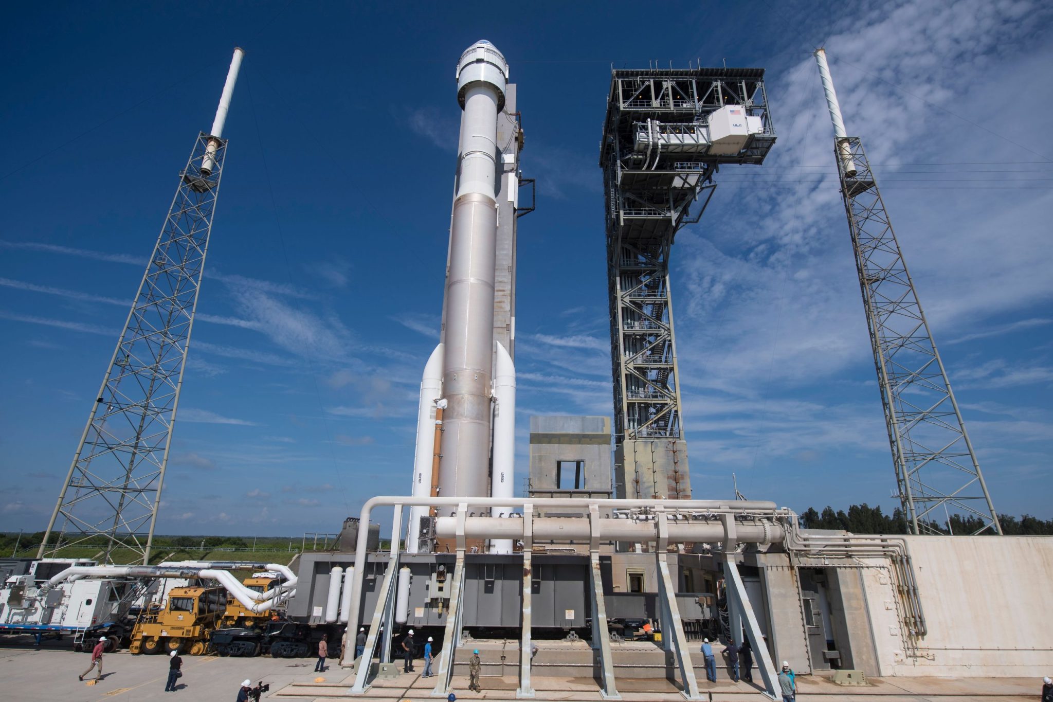 Atlas V rocket with Starliner on launch pad