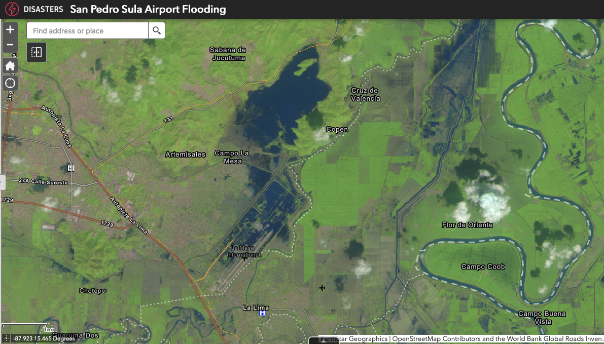 Screenshot of flooding near the San Pedro Sula airport on a website offered by the NASA disasters program. The image is mostly green with a large splotch of blue water extending over the center of the image.