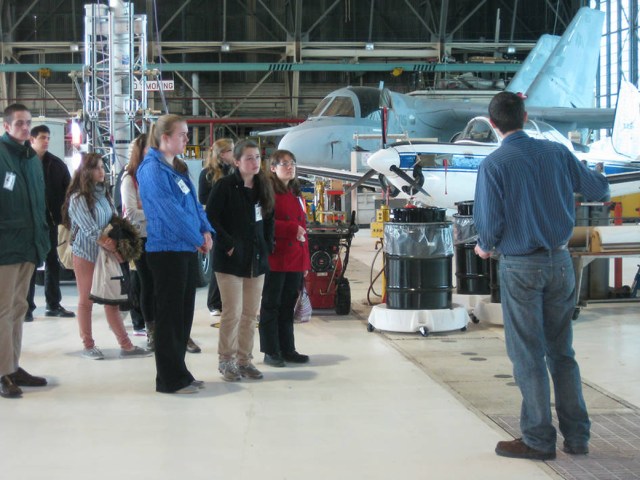 High school students shadowing a technician at NASA Glenn's Flight Research Building