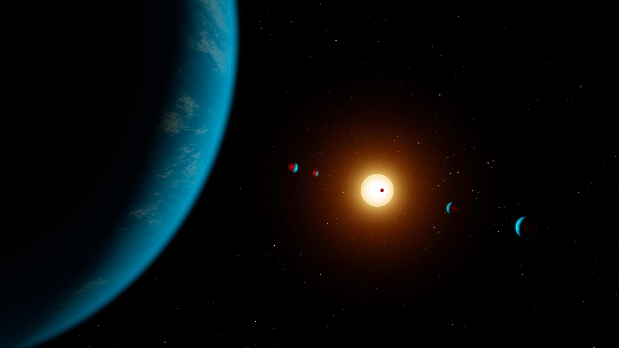 This artist's illustration shows the planetary system K2-138, which was discovered by citizen scientists in 2017 using data from NASA's Kepler space telescope.
