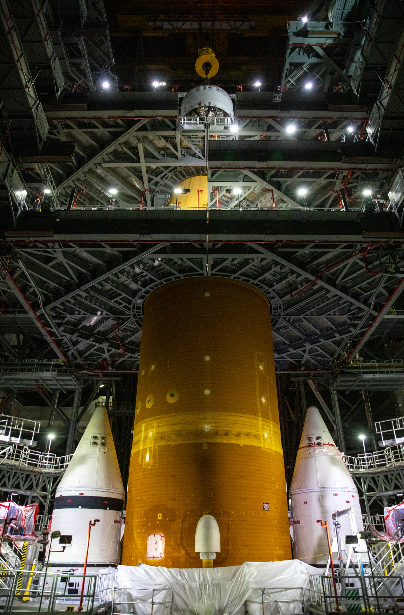 Crews  are assembling the Space Launch System rocket that will power NASA’s Artemis I.