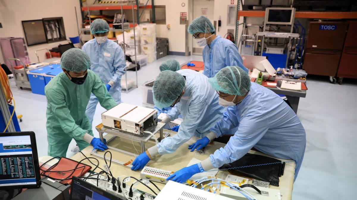 The OMOTENASHI team prepares their secondary payload for a ride on the SLS rocket during the Artemis I mission. 