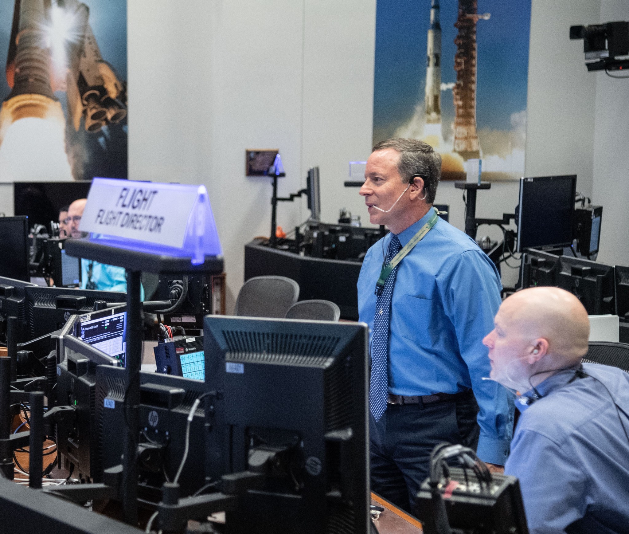 Artemis I flight directors Rick LaBrode (left) and Judd Frieling (right) inside the White Flight Control Room at the Johnson Space Center in Houston during a simulation.