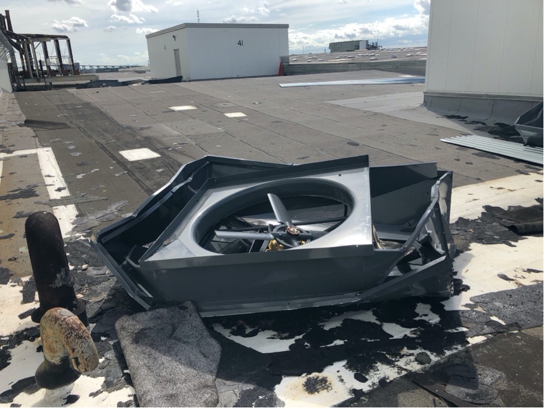A damaged fan dislodged from the roof is seen on Building 103 at NASA’s Michoud Assembly Facility. 