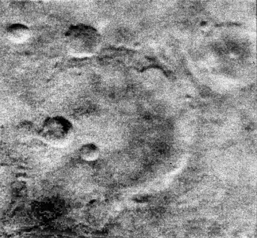 On July 15, 1965, Mariner 4 transmitted this image of the Martian surface from 7,829 miles away. The photograph shows a 94-mile diameter crater.