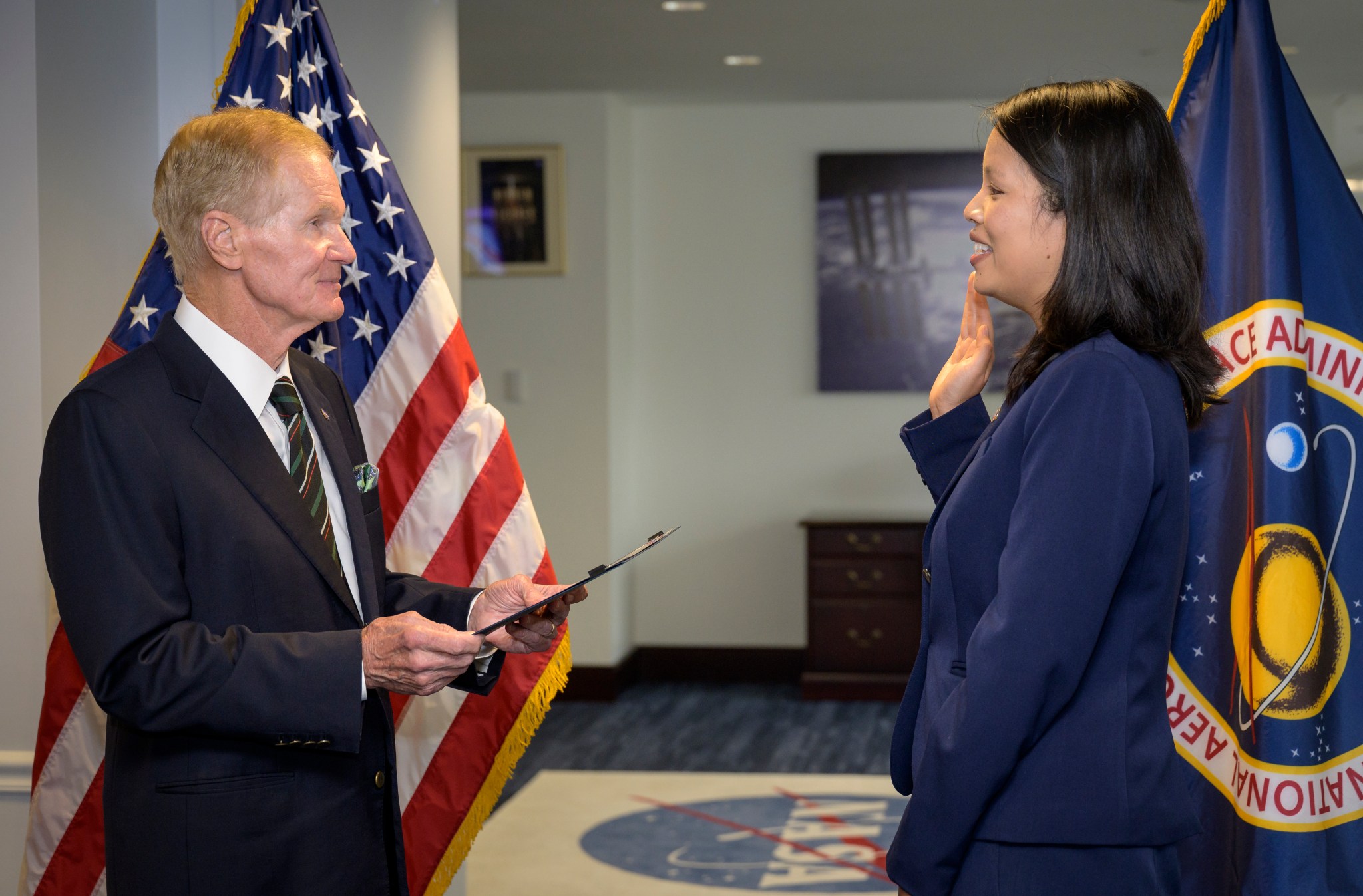 NASA Administrator Bill Nelson, left, swears in Margaret Vo Schaus as NASA's Chief Financial Officer, Wednesday, Aug. 4, 2021, at the Mary W. Jackson NASA Headquarters building in Washington.