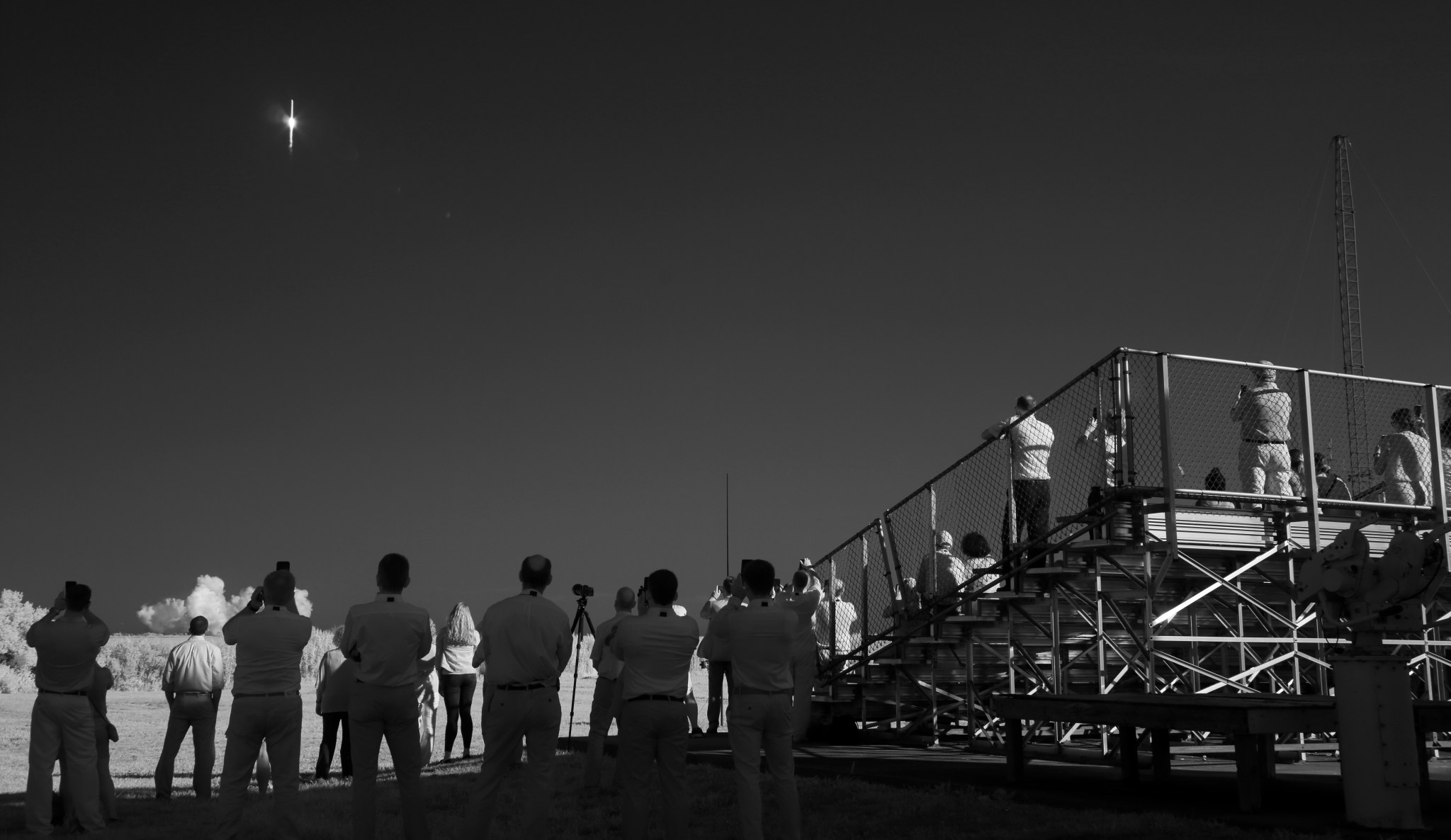 In this black and white infrared image, a Northrop Grumman Antares rocket carrying a Cygnus resupply spacecraft launches from  Pad-0A of the Mid-Atlantic Regional Spaceport, Tuesday, Aug. 10, 2021.