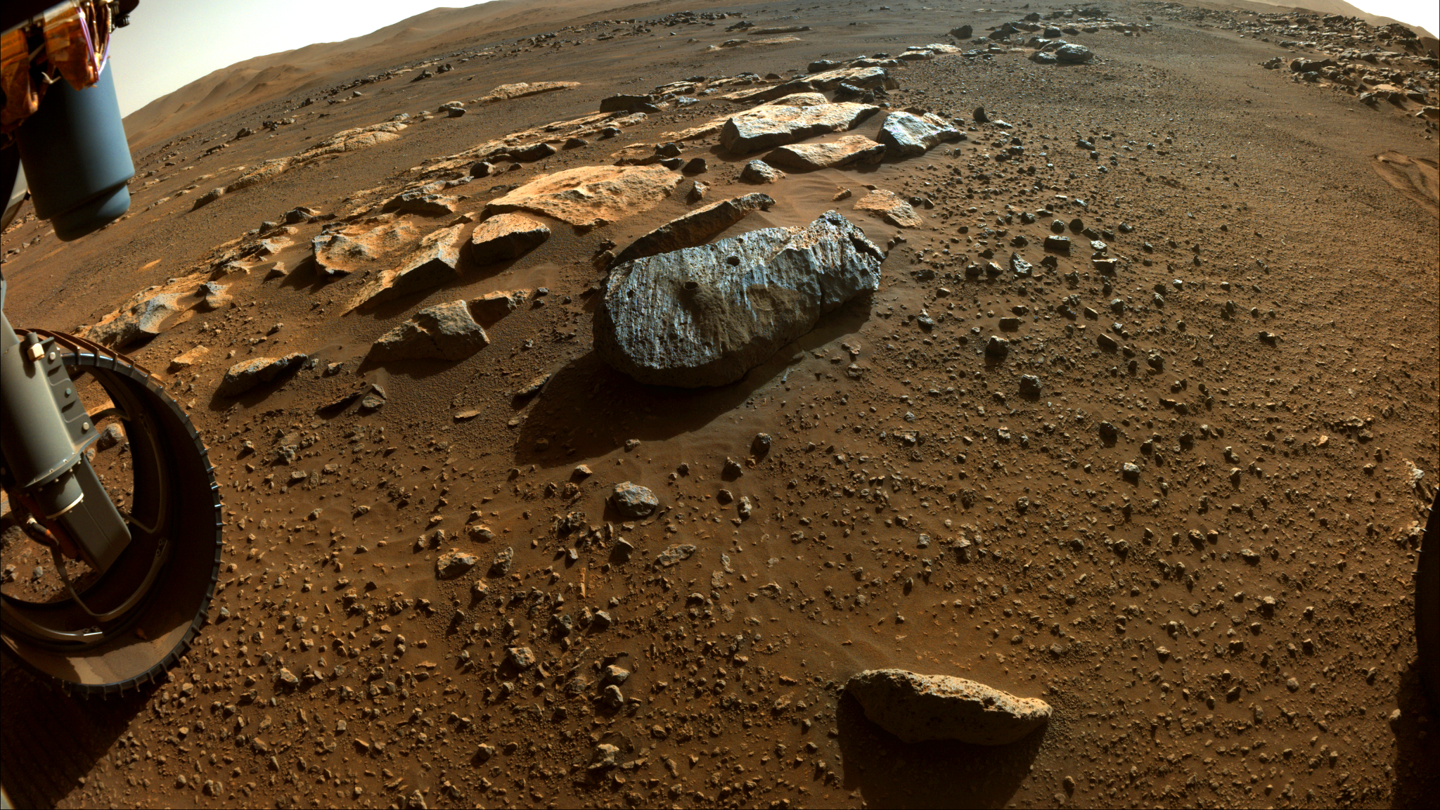 The rock, nicknamed “Rochette,” from which NASA’s Perseverance rover obtained its first core samples, seen with two holes drilled in it.