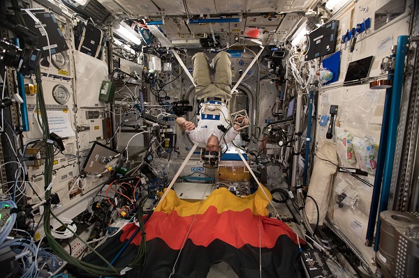image of an astronaut working with a VR experiment