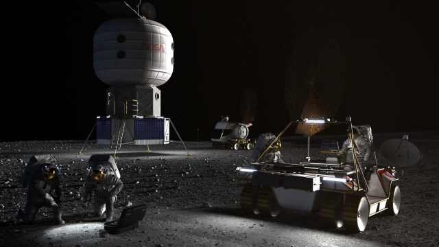 Artist concept of astronauts in the xEMU space suit setting up science experiments on the lunar surface.