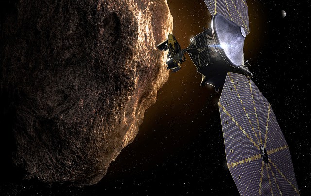 Illustration of the Lucy spacecraft near a large asteroid with Jupiter visible in the distant background