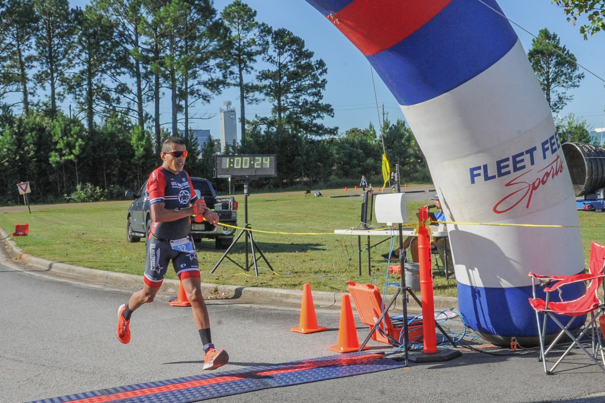 Miguel Contreras of Huntsville crosses the finish line at 1 hour, 23 seconds, to win the 2021 Racin’ the Station duathlon.