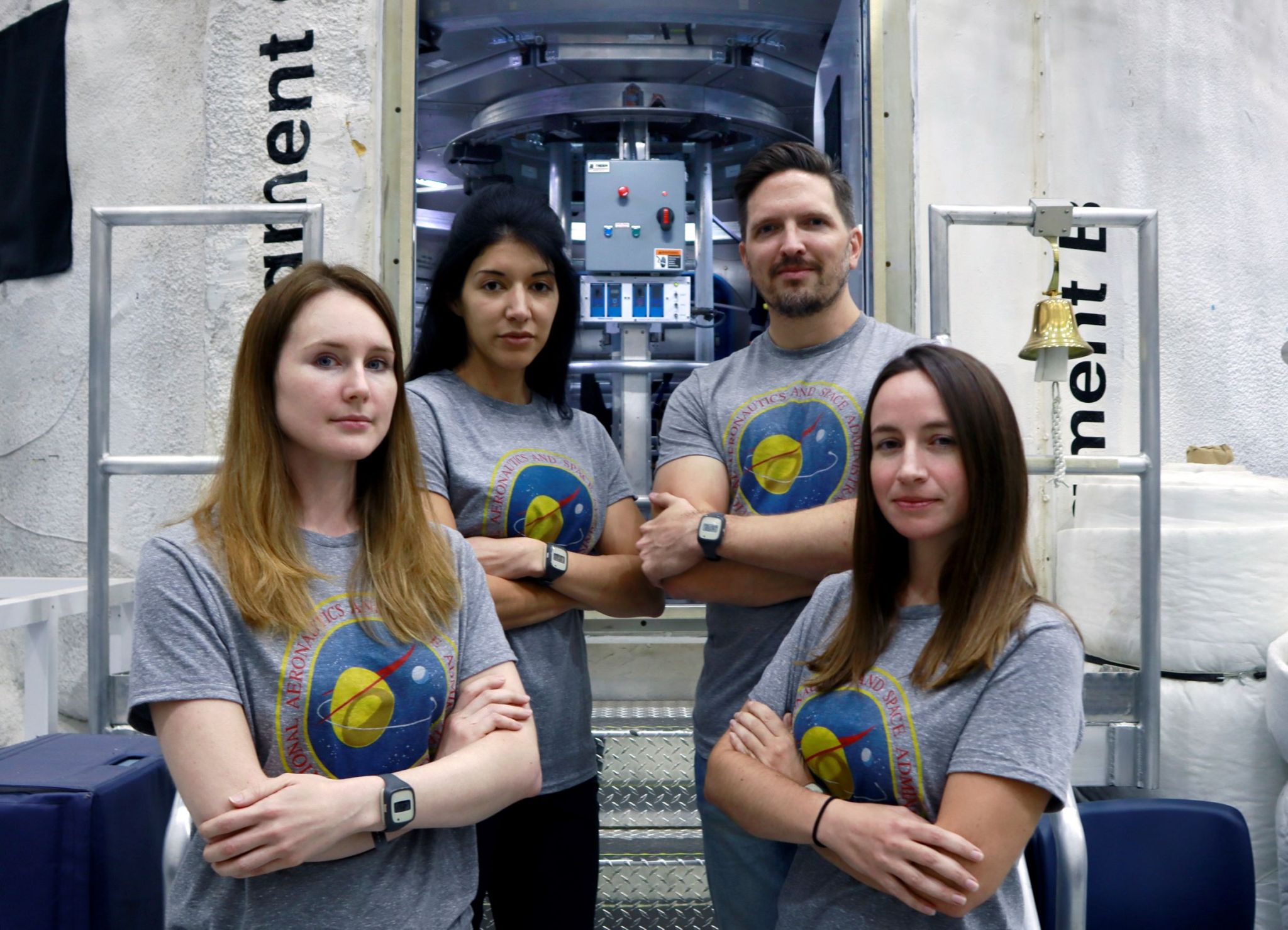 The new crew for the upcoming mission of NASA's Human Exploration Research Analog, or HERA, stands in front of the habitat that will be their home for 45 days. From left to right: Lauren Cornell, Monique Garcia, Christopher Roberts, and Madelyne Willis. 