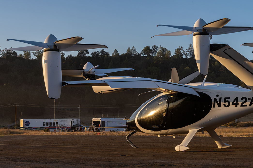 NASA’s Mobile Acoustics Facility is parked in the background of Joby’s aircraft at Joby’s Electric Flight Base.