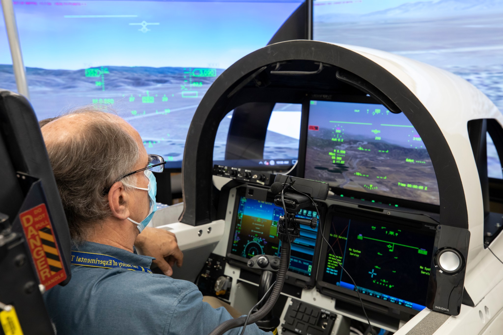 Flight software being tested in cockpit simulation.